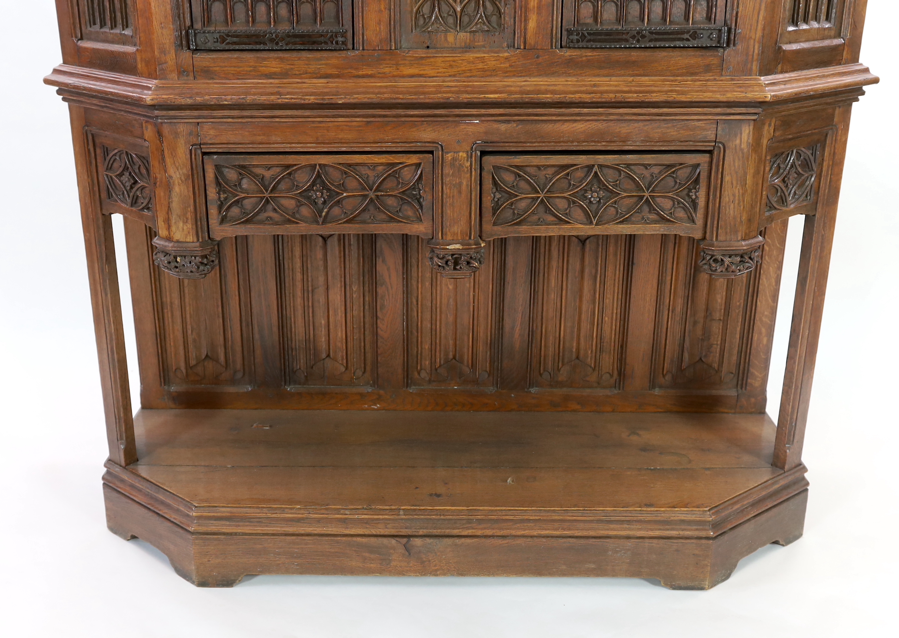 An antique oak dresser, based on a 15th century French gothic model and very similar to an example in the Wallace Collection